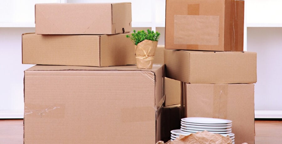 Pile of cardboard boxes ready for decluttering to move house